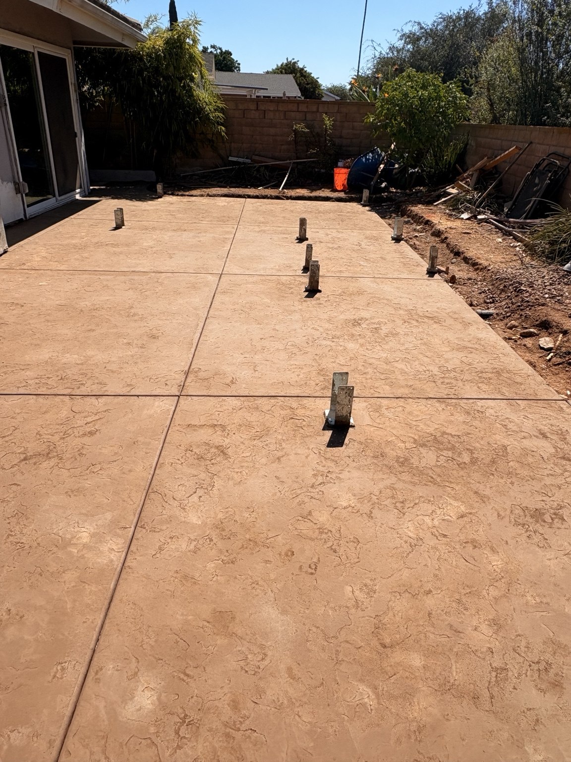 Tan textured concrete patio — Pete and Sons Concrete Inc.