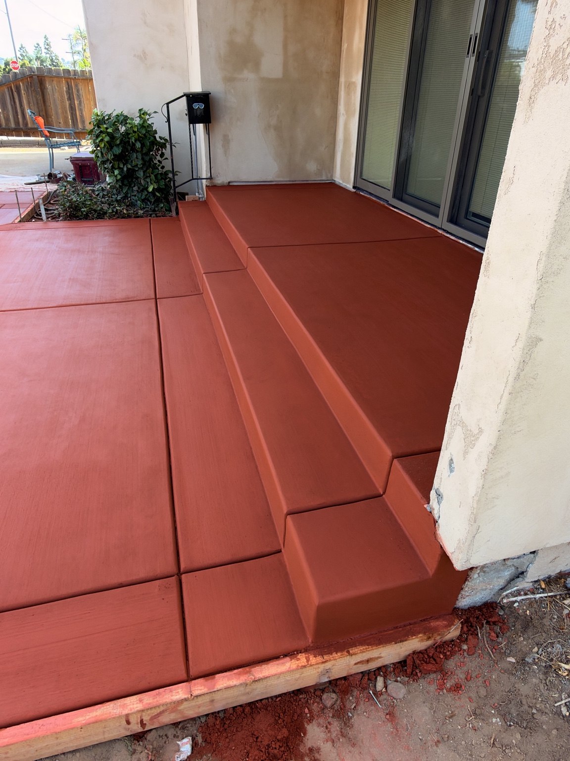 Red concrete patio and steps — Pete and Sons Concrete Inc.
