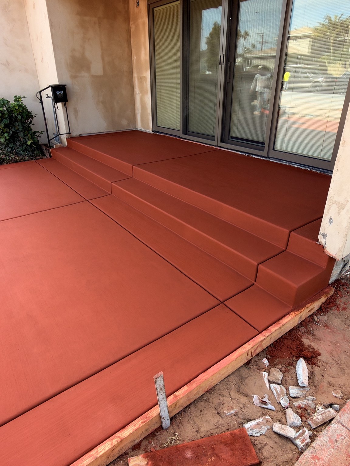 Red concrete patio and steps — Pete and Sons Concrete Inc.