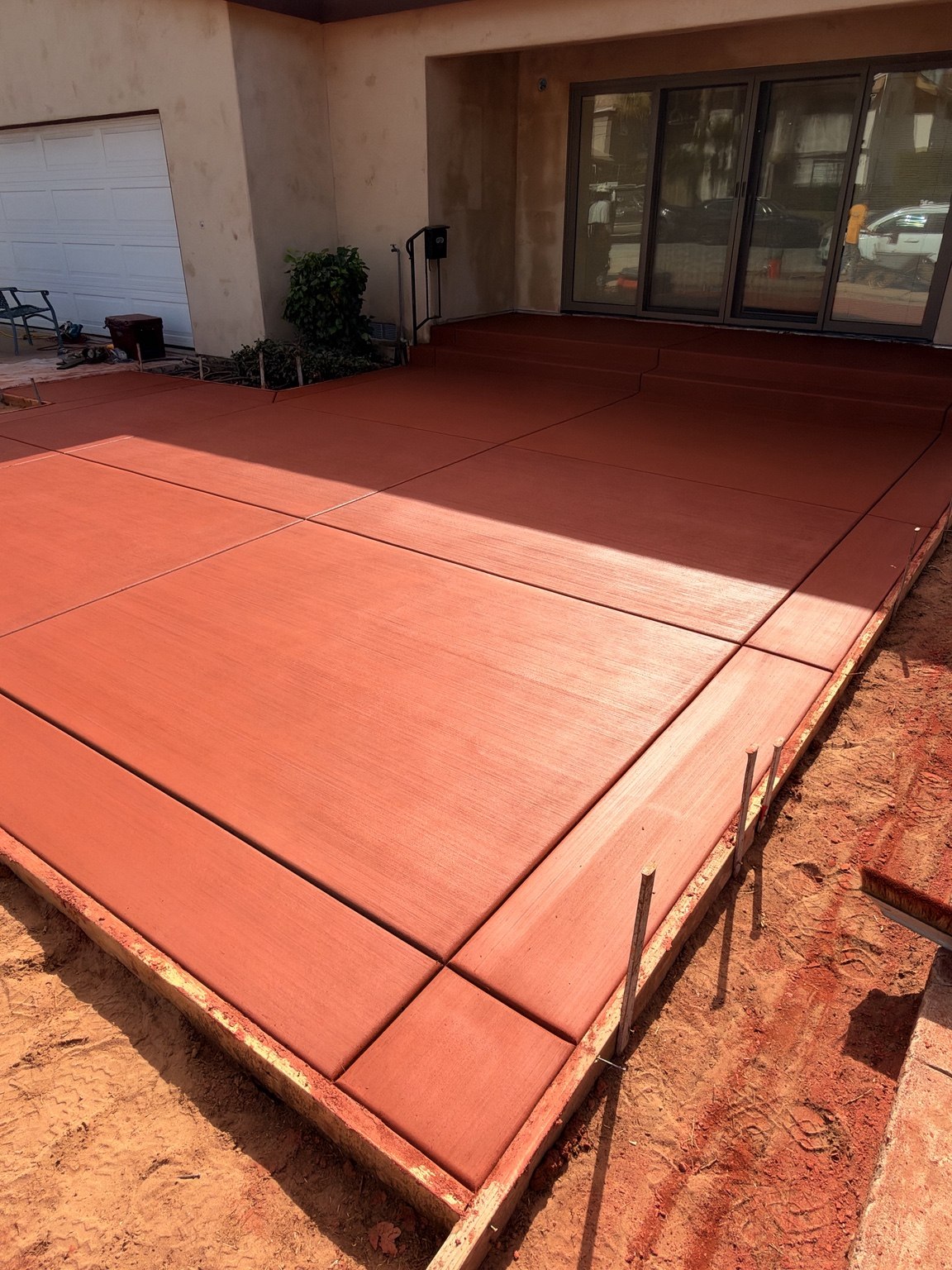 Red concrete patio and steps — Pete and Sons Concrete Inc.