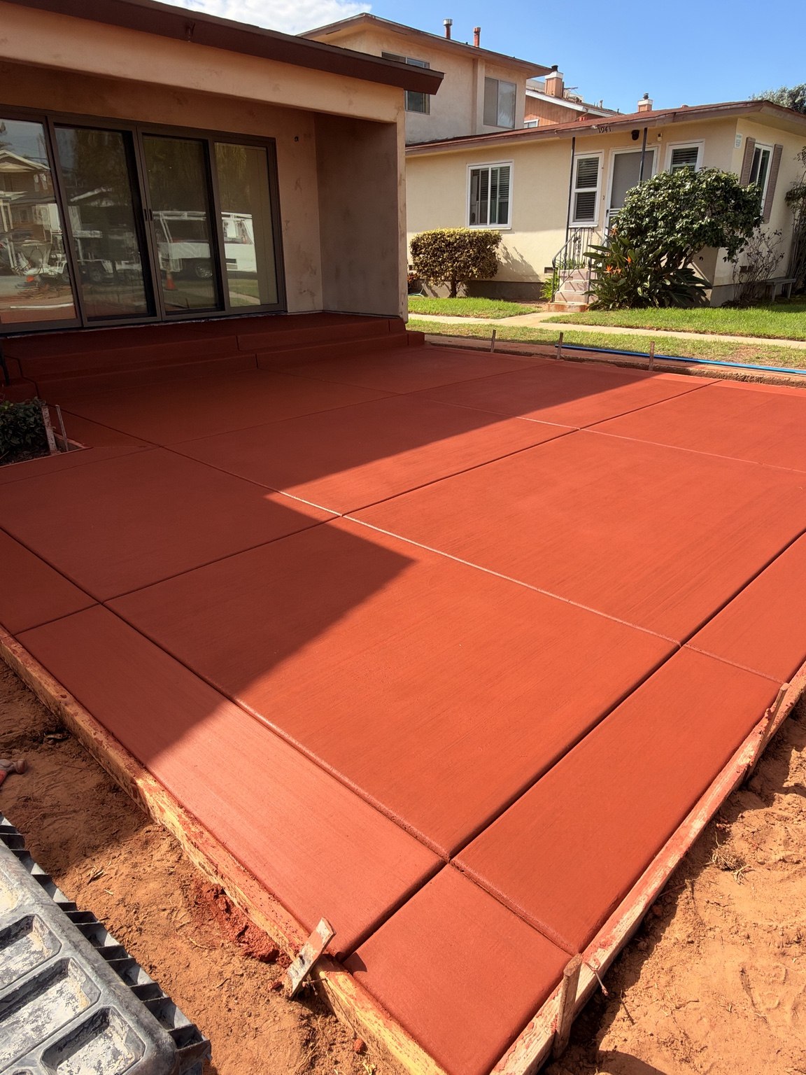 Red concrete patio and steps — Pete and Sons Concrete Inc.